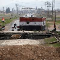 A checkpoint held by Syrian forces loyal to President Bashar Assad is pictured in Aleppo, Syria, Saturday. | REUTERS