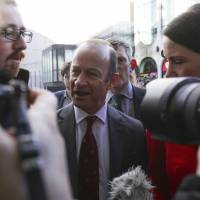 UKIP leader Henry Bolton arrives for a party meeting in Birmingham, England, on Saturday. | PA / VIA AP