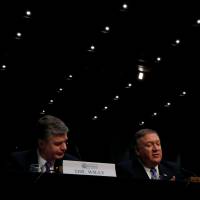 FBI Director Christopher Wray (left) listens as CIA Director Mike Pompeo testifies next to Director of National Intelligence Dan Coats during a Senate Intelligence Committee hearing on \"Worldwide Threats\" on Capitol Hill in Washington Tuesday. | REUTERS