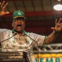 Departing African National Congress (ANC) President and current South African President Jacob Zuma gestures as he addresses delegates at the 54th ANC conference in Johannesburg in December. South Africa\'s calm and often jovial Jacob Zuma is a former herdboy who fought in the anti-apartheid struggle and has clung on to the presidency despite a string of scandals. Now aged 75, he has survived by building a network of loyal African National Congress (ANC) lawmakers and officials, and by trading on the party\'s legacy as the organization that ended white-minority rule. | AFP-JIJI