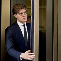 Alex Van der Zwaan, former associate at Skadden Arps Slate Meagher &amp; Flom UK LLP, exits Federal Court in Washington on Tuesday. Van der Zwaan was charged on Feb. 16 with making false statements to federal authorities as part of Special Counsel Robert Mueller\'s probe of Russian collusion in the 2016 presidential election. | BLOOMBERG