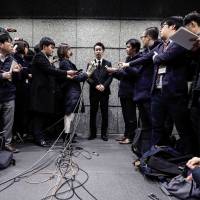 Yusuke Otsuka, chief operating officer and co-founder of cryptocurrency exchange Coincheck Inc., faces the media at its headquarters in Tokyo last week. Clients pulled &#165;40.1 billion from the exchange on Tuesday, the first day they were allowed to make withdrawals since it was hit by a cybertheft last month. | BLOOMBERG
