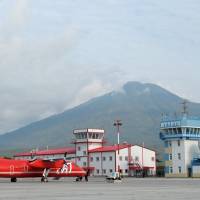 A civilian plane stands at Iturup Airport on the island of Etorofu in the disputed Northern Territories, in this 2014 file image. This week the airport was given a dual civil-military status, clearing the way for the Russian Air Force to set up a base at the site. | PRESS SERVICE OF THE PRESIDENT OF RUSSIA / KREMLIN.RU