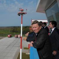 Sergei Ivanov, chief of staff to Russian President Vladimir Putin, views Iturup Airport on Etorofu in the disputed Northern Territories, during a 2014 visit. This week the airport was given a dual civil-military status, clearing the way for the Russian Air Force to set up a base at the site. | PRESS SERVICE OF THE PRESIDENT OF RUSSIA / KREMLIN.RU