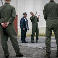 Lt. Col. Bryan G. Swenson (second from right) gives U.S. Navy World War II veteran Don Irwin (second from left) an explanation about the MV-22 Osprey in April at Marine Corps Air Station Futenma in Ginowan, Okinawa. | III MARINE EXPEDITIONARY FORCE
