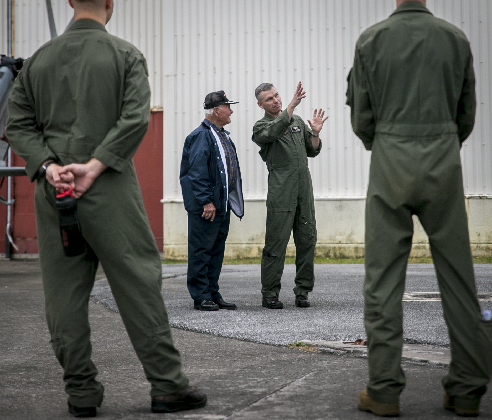 Lt. Col. Bryan G. Swenson (second from right) gives U.S. Navy World War II veteran Don Irwin (second from left) an explanation about the MV-22 Osprey in April at Marine Corps Air Station Futenma in Ginowan, Okinawa. | III MARINE EXPEDITIONARY FORCE