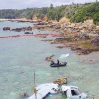 The wreckage of an MV-22 Osprey that ditched off Nago, Okinawa Prefecture, in December 2016 is shown in this photo taken by a drone. | KYODO