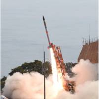 The world\'s smallest satellite-carrying rocket is launched Saturday at the Uchinoura Space Center in Kagoshima Prefecture. | JAPAN AEROSPACE EXPLORATION AGENCY / VIA KYODO