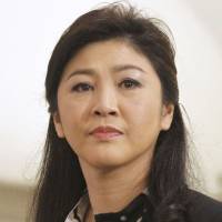 Yingluck Shinawatra (left) and her brother Thaksin Shinawatra | REUTERS