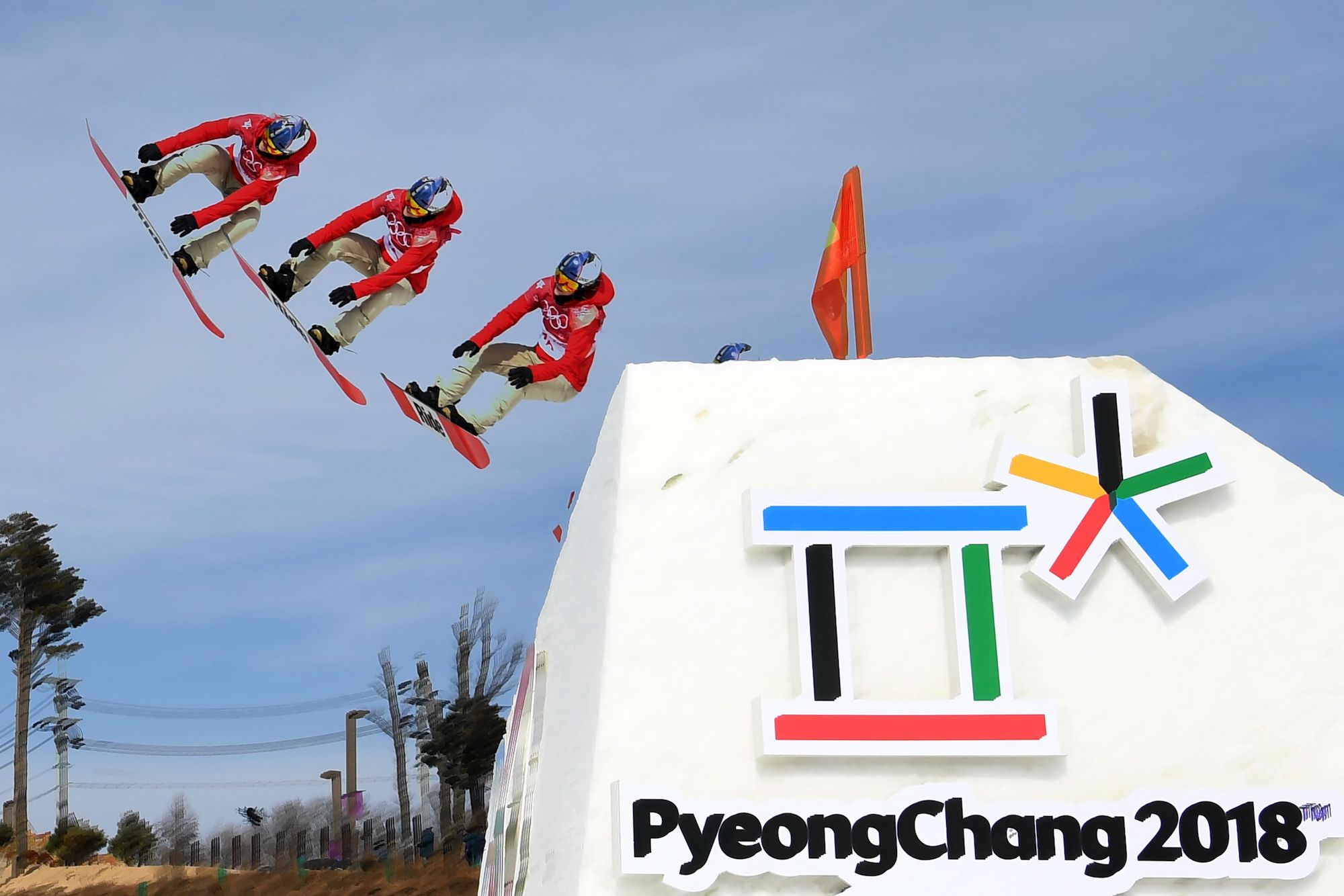 Multiple exposure photo shows Switzerland's Isabel Derungs during the qualification of the women's snowboard big air event at the Alpensia Ski Jumping Centre. | AFP-JIJI