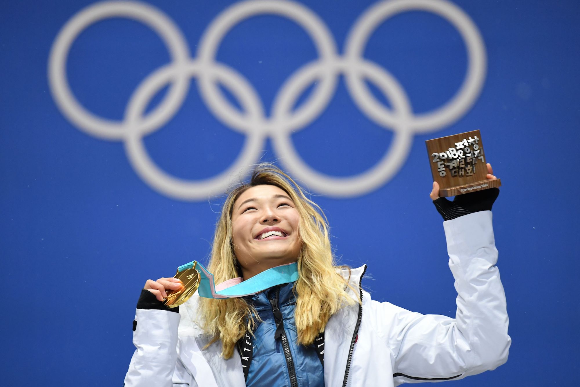 Gold medalist Chloe Kim poses on the podium during the medal ceremony for the snowboard women's halfpipe at the Pyeongchang Medals Plaza on Tuesday.  | AFP-JIJI