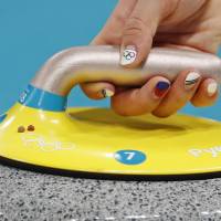 A close-up shows the nails of Kim Kyeong-ae of South Korea as she delivers a stone during the women\'s round robin between China and South Korea. | REUTERS