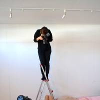 Kiina Matsunaga poses for a photo to add to her portfolio (an example of which can be seen right) at Moffy Photo Studio in Osaka. | J.J. O\'DONOGHUE