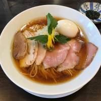 Triple crown: At Men Labo Hiro, the noodles come topped with slices of pork, chicken and duck. | ROBBIE SWINNERTON