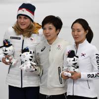 White knight: Gold medallist Nao Kodaira holds an Olympic mascot while posing for a photo with South Korea\'s Lee Sang-hwa and Czech Republic\'s Karolina Erbanova after the women\'s 500-meter speed skating competition on Feb. 18. | AFP-JIJI