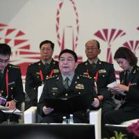 Chinese Minister of National Defense Gen. Chang Wanquan addresses an informal meeting of the ASEAN-China defense ministers in Singapore on Tuesday. The past year has witnessed a dramatic change in the attitude of Association of Southeast Asian Nations toward China, and member states are finding themselves under growing scrutiny by Beijing. | AFP-JIJI