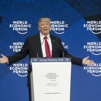 U.S. President Donald Trump speaks Jan. 26 at the World Economic Forum in Davos, Switzerland. He stated that the U.S. would consider negotiating trade deals with its onetime TPP partners \"either individually, or perhaps as a group\" &#8212; but only \"if it is in the interests of all.\" | BLOOMBERG