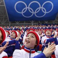 North Korean cheerleaders attend the Czech Republic-South Korea men\'s ice hockey match in Gangneung, South Korea, on Thursday. | REUTERS