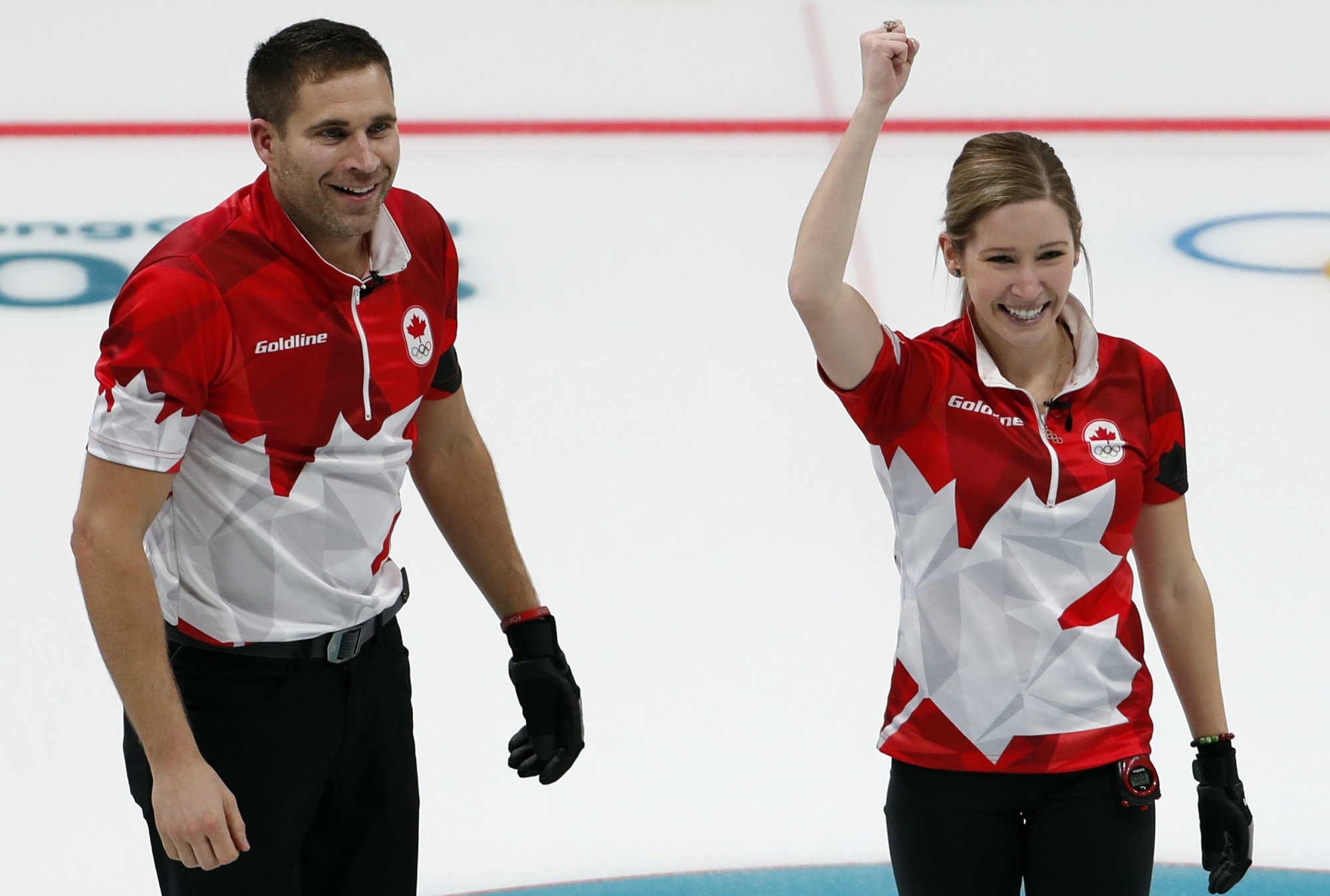 Canada's Kaitlyn Lawes and John Morris celebrate their gold medal in the mixed doubles curling final against Switzerland on Tuesday at Gangneung Curling Center. | REUTERS