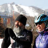 Guido Huwiler and his wife, Rita Ruettimann, speak during an interview in Pyeongchang, South Korea, on Thursday. | REUTERS