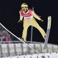 Noriaki Kasai takes his second jump during the men\'s normal hill final at the Pyeongchang Olympics on Saturday.  Kasai finished 21st. | KYODO