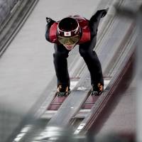 Ryoyu Kobayashi takes off during qualification for the men\'s large hill individual ski jumping competition at the 2018 Winter Olympics in Pyeongchang, South Korea, Friday. | AP