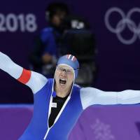Norway\'s Havard Lorentzen celebrates after winning the men\'s 500-meter speedskating gold medal at the Pyeongchang Games on Monday. | AP