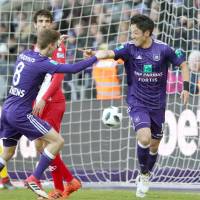 Ryota Morioka (right) celebrates after scoring for Anderlecht against Mouscron in the Belgian league on Sunday. | KYODO