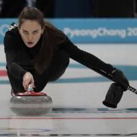 Olympic Athlete of Russia Anastasia Bryzgalova practices for the Olympic mixed doubles curling competition on Wednesday in Gangneung, South Korea. | AP