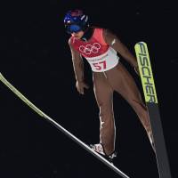 Poland\'s Kamil Stoch competes in the men\'s large hill individual ski jumping qualifying event on Saturday. Stoch captured the gold medal. | AFP-JIJI