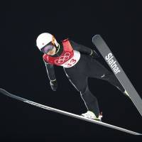 Sara Takanashi competes in the women\'s normal hill ski jump finals at Alpensia Ski Jumping Centre on Monday night. | REUTERS