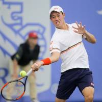 Kei Nishikori hits a return to Germany\'s Matthias Bachinger in the second round of the RBC Tennis Championships of Dallas on Wednesday. Nishikori advanced with a 4-6, 6-4, 6-4 victory. | KYODO
