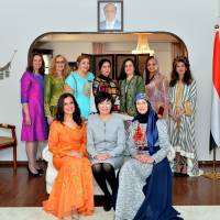 Japan first lady Akie Abe (front row, center), poses for a group photo with Maali Siam (front row, left), wife of the Palestinian ambassador, and Jamila Al-Gunaid (front row, right), wife of the Yemeni ambassador, at a luncheon at the Yemeni ambassador\'s residence on Jan. 30 hosted by The Society of Wives of Arab Ambassadors in Japan (SWAAJ). Other members include representatives from Tunisia, Algeria, Oman, Kuwait, Jordan, Sudan and  Egypt. | MIKI OSHITA