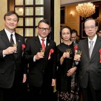 Indonesian Ambassador Arifin Tasrif (second from left), and his wife, Ratna Mirah, welcome Parliamentary Vice-Minister for Foreign Affairs Iwao Horii (left) and Yasuo Fukuda, former prime minister and president of the Japan-Indonesia Association, during a reception at the ambassador\'s residence on Jan. 24 to celebrate the 60th anniversary of diplomatic relations between Indonesia and Japan. | YOSHIAKI MIURA