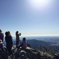 Participants on a \"geo tour\" specifically for women enjoy the view from the top of the mountain. | MT. TSUKUBA AREA GEOPARK PROMOTION COUNCIL