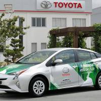 Toyota Motor Corp. unveils a prototype of the world\'s first hybrid vehicle to run on ethanol, in Brazil on Tuesday. | TOYOTA MOTOR CORP. VIA KYODO