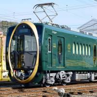 Kyoto\'s Eizan Electric Railway Co. unveiled Wednesday a new carriage featuring a huge golden oval on the front and a luxurious interior. | KYODO