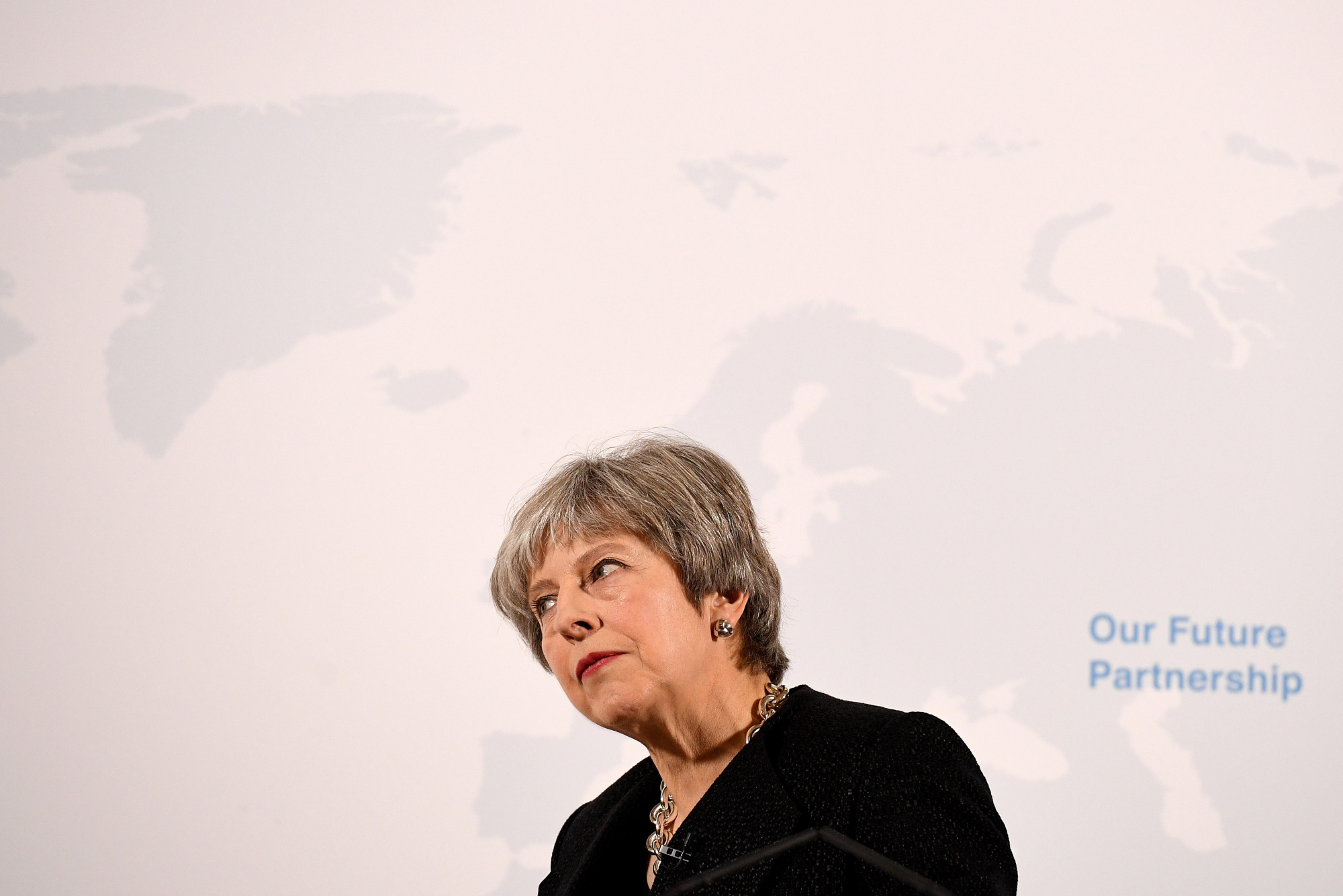 British Prime Minister Theresa May listens to a question from a member of the audience after giving a speech on Brexit and the European Union at Mansion House in London on Friday. | AFP-JIJI