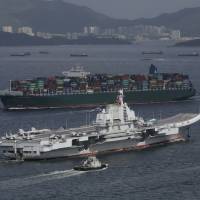 The Liaoning, China\'s first aircraft carrier, sails into Hong Kong for a port call on July 7, 2017. | AP