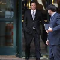 Paul Manafort (left), President Donald Trump\'s former campaign chairman, and his wife, Kathleen Manafort, walk behind spokesman Jason Maloni as they leave the Alexandria Federal Courthouse after an arraignment hearing in Alexandria, Virginia, Thursday. | AP