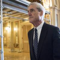Special counsel Robert Mueller departs after a meeting on Capitol Hill in Washington last June. | AP