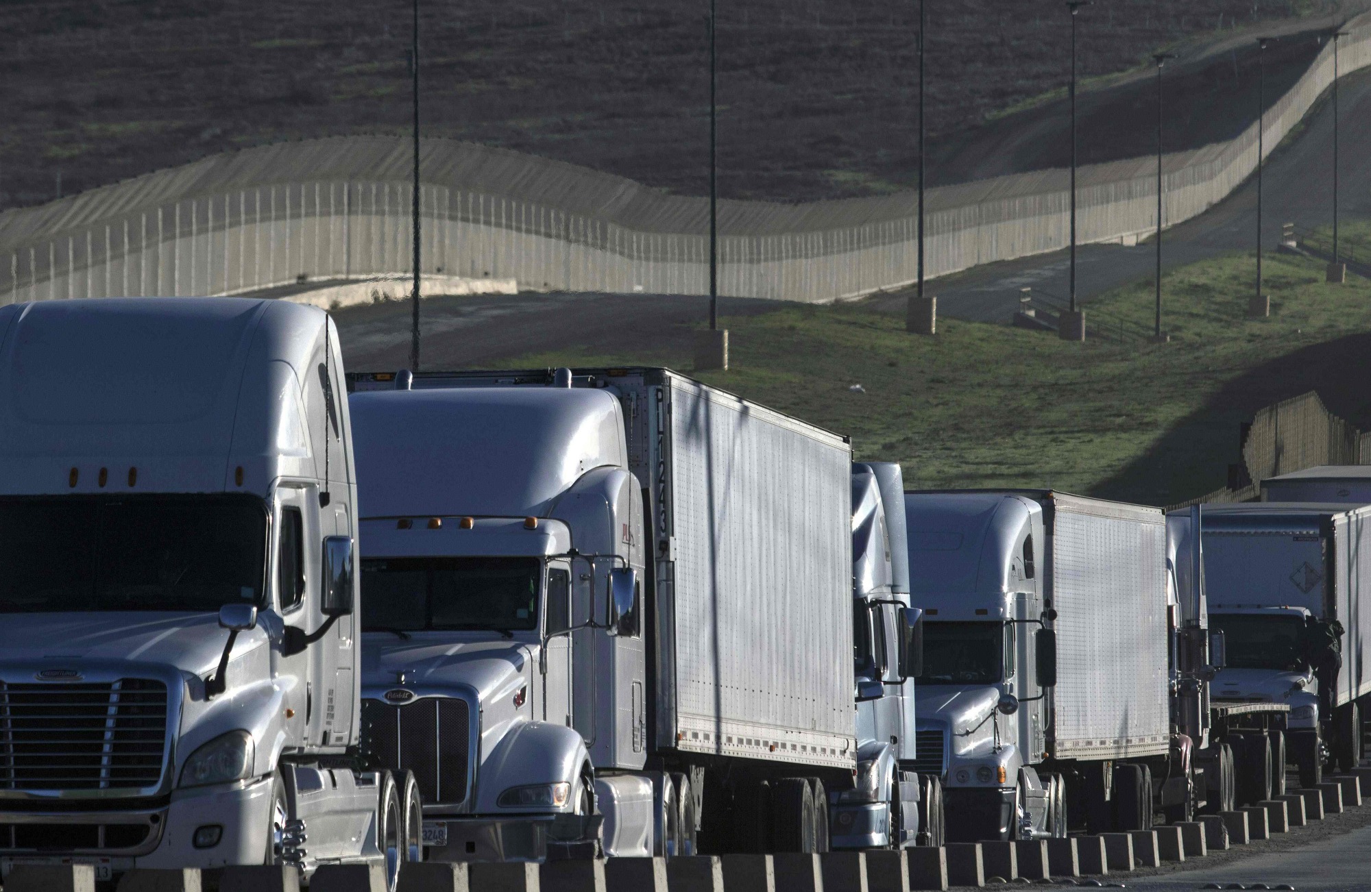 Trucks line up to cross the border to the United States at the Otay Mesa Commercial Port of Entry in Tijuana, Mexico, on Jan. 22. | AFP-JIJI