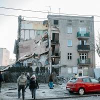 A collapsed building is seen Sunday in Poznan, Poland in this picture obtained from social media. | COURTESY OF INSTAGRAM / @PAWEL_ALTERNATYWNA / VIA REUTERS