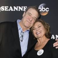 Actor John Goodman and actress/executive producer Roseanne Barr attend The Roseanne Series Premiere at Walt Disney Studios in Burbank, California, March 23. Hit U.S. working-class comedy \"Roseanne\" returns after a two-decade hiatus with the eponymous star now a pill-popping, Trump-voting grandmother winning largely positive reviews in a sharply polarized America. | AFP-JIJI