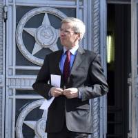 The British ambassador to Russia, Laurie Bristow, leaves after a meeting at the Russian foreign ministry building in Moscow on Friday. | AP