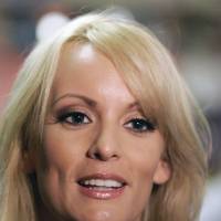 Stormy Daniels visits a restaurant in downtown New Orleans in 2009. The adult film actress who said she had sex with President Donald Trump is offering to return the &#36;130,000 she was paid for agreeing not to discuss their alleged relationship. An attorney for Stormy Daniels, whose real name is Stephanie Clifford, sent a letter to Trump\'s lawyer Monday, saying she would wire the money to Trump if she could speak openly about their relationship. | AP
