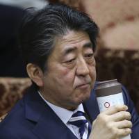 Prime Minister Shinzo Abe, who is still being dogged by a cronyism scandal involving school operator Moritomo Gakuen, is seen at the Upper House Budget Committee on Monday. | AP
