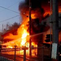 Smoke rises Sunday as Miki Station is engulfed by fire on the Ao Line run by Kobe Electric Railway Co. in this photo taken by a resident of Miki, Hyogo Prefecture. | KYODO