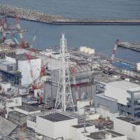 An aerial view of the crippled Fukushima No. 1 nuclear power plant is seen on Feb. 21. | KYODO