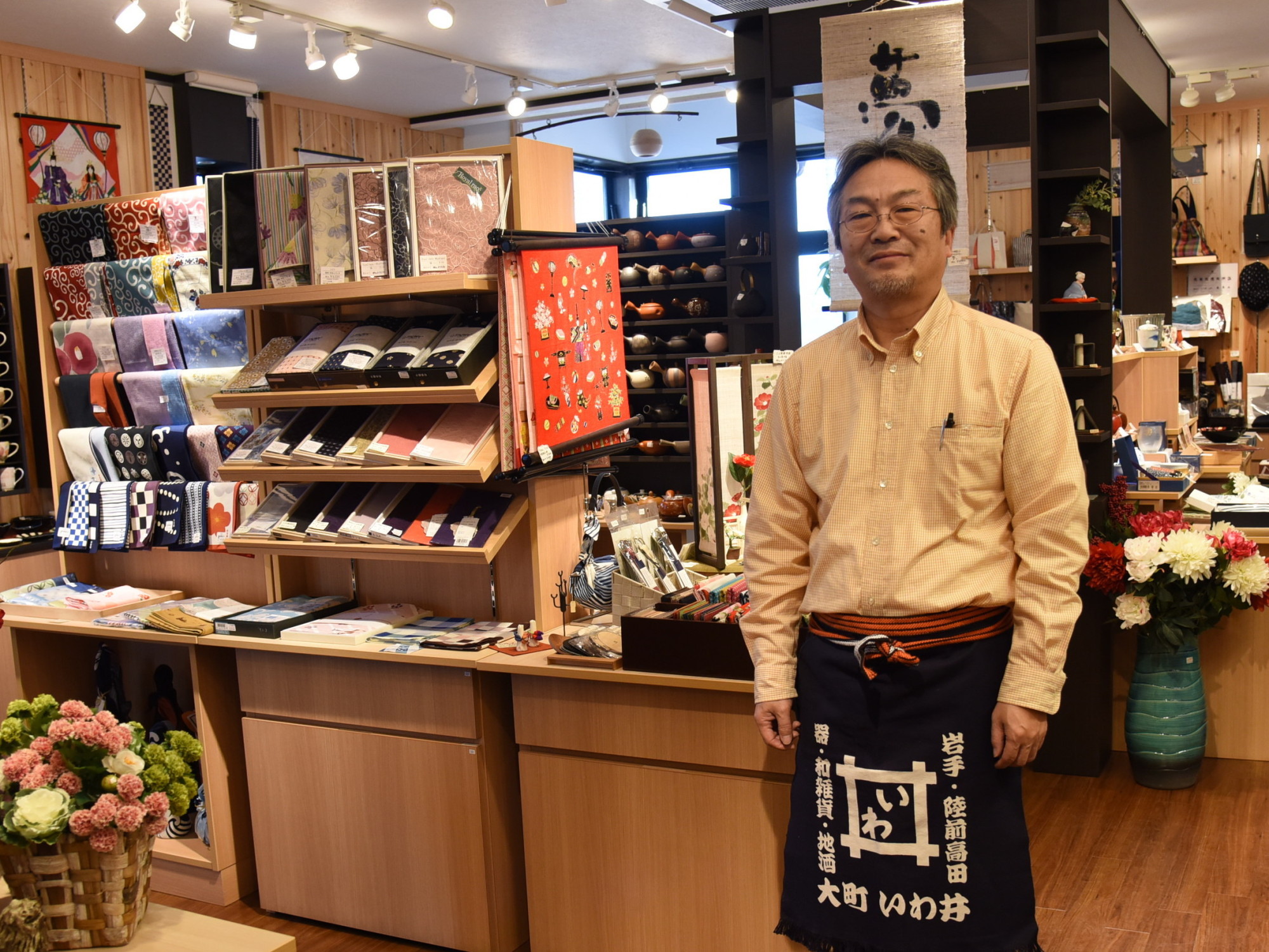 Seitoku Iwai, a 12th-generation shop owner in Rikuzentakata, Iwate Prefecture, says there's a certain joy in re-creating a community from scratch. | SATOKO KAWASAKI